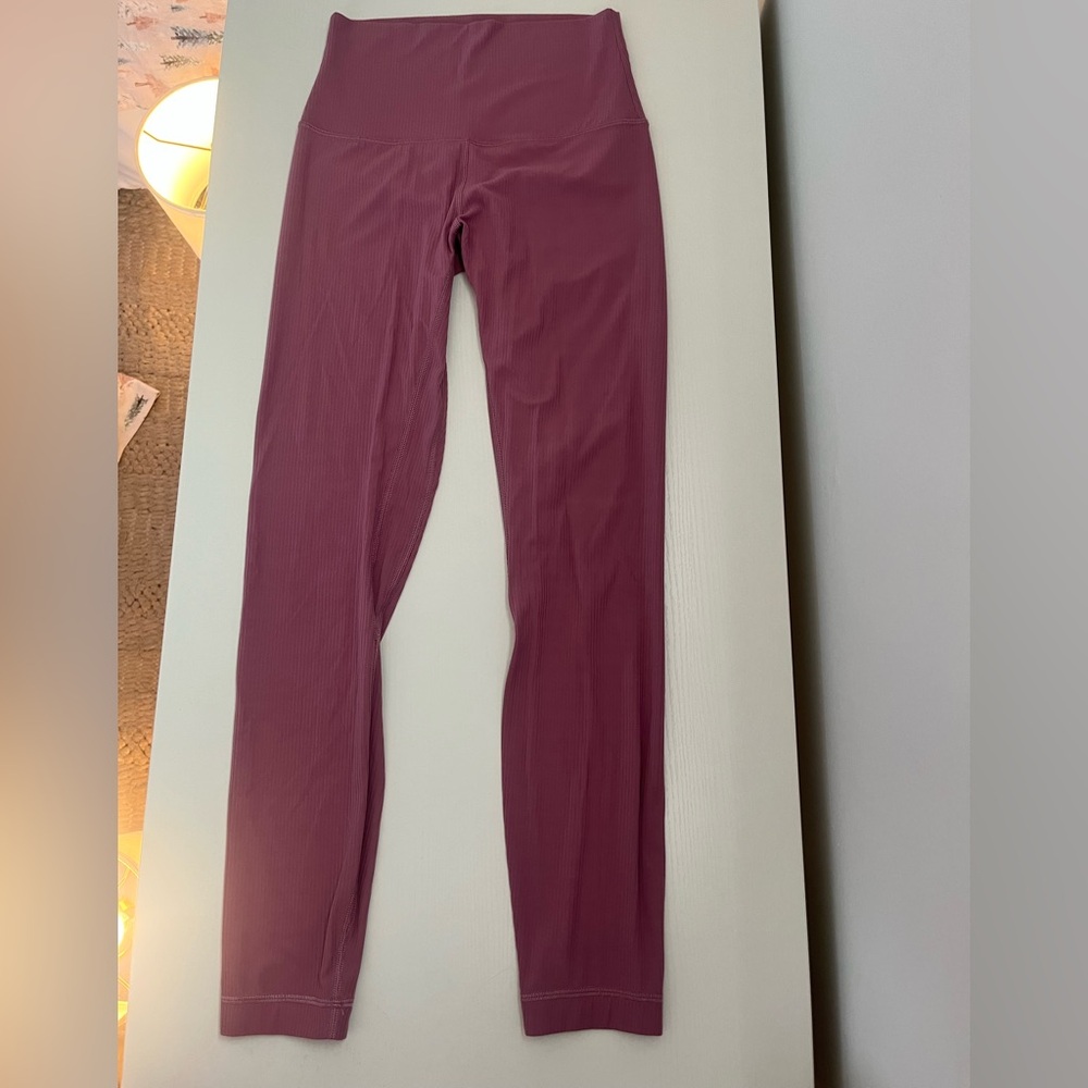 Lululemon: Ribbed blush pink athletic leggings 
Size- 4 Length-  25’in